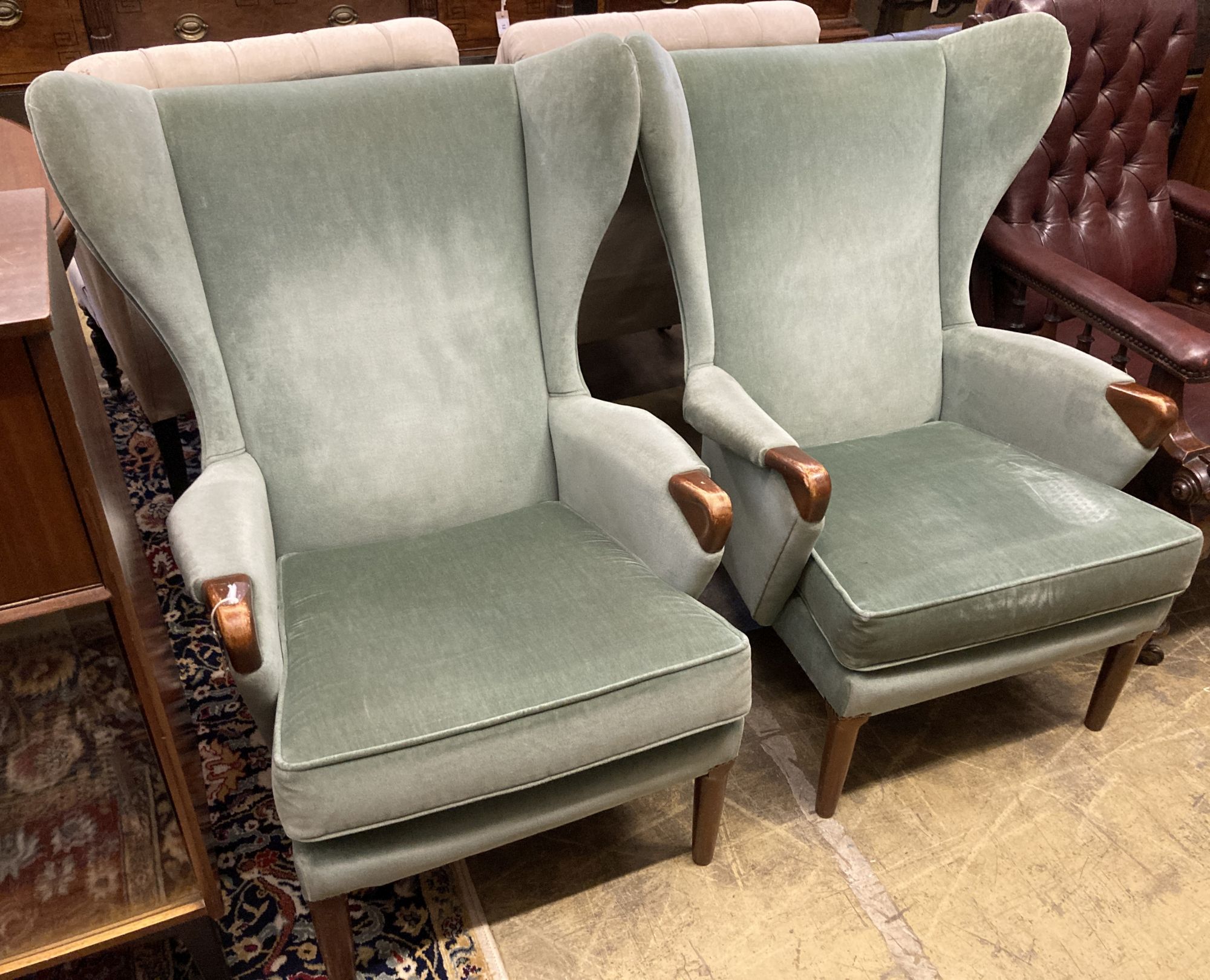 A pair of Parker Knoll Model 757 wing armchairs, width 79cm, depth 88cm, height 100cm